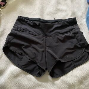 size 2 black lululemon shorts with a little stain on the front